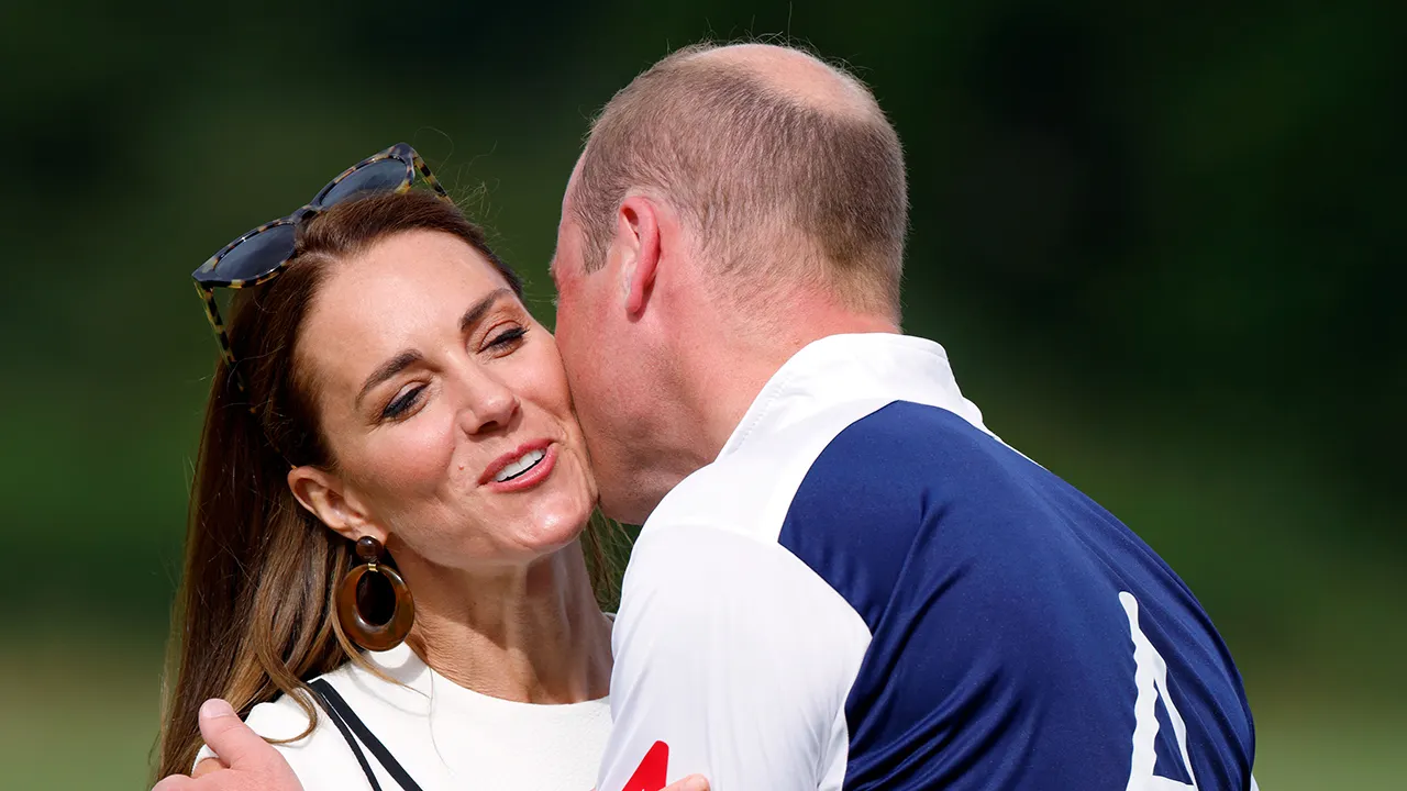 prince william was filmed secretly kissing kate middleton's hand.